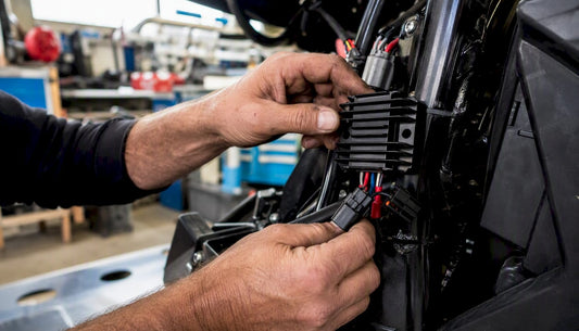 Rider hands checking voltage regulator wiring