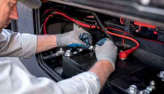 Technician wiring battery monitor shunt in RV
