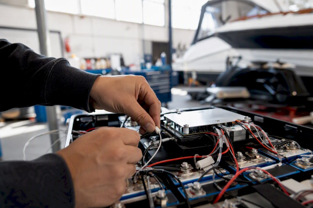 Technician wiring lithium battery management system